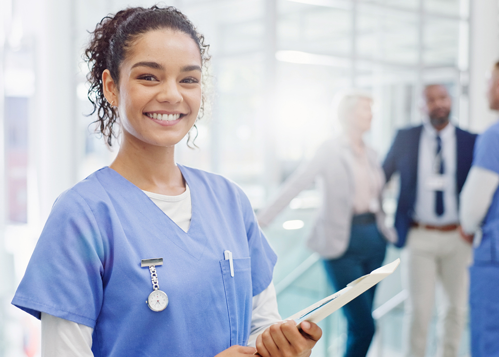 Smiling nurse with the medical team