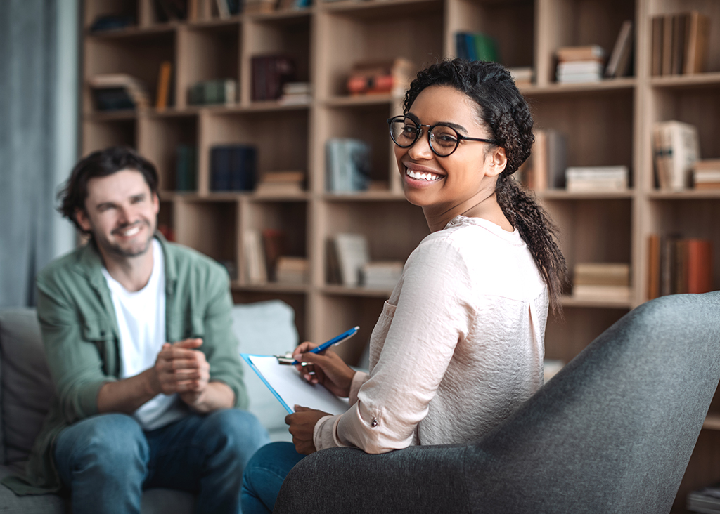 psychologist with a satisfied client patient